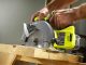A beginner woodworker using the Ryobi 18V circular saw to cut plywood for a shelf project in a bright garage workshop