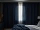 Blackout curtains keeping a bedroom cool during a sunny day