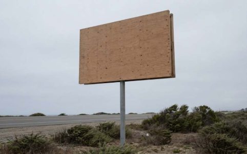 Outdoor business sign damaged by strong Dallas winds