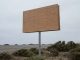 Outdoor business sign damaged by strong Dallas winds