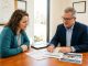 Homebuyer comparing the lowest mortgage rates in Alabama with a lender